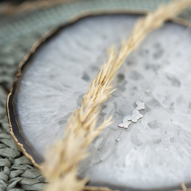 Day & Eve  Zilverkleurige armband met drie vlinders