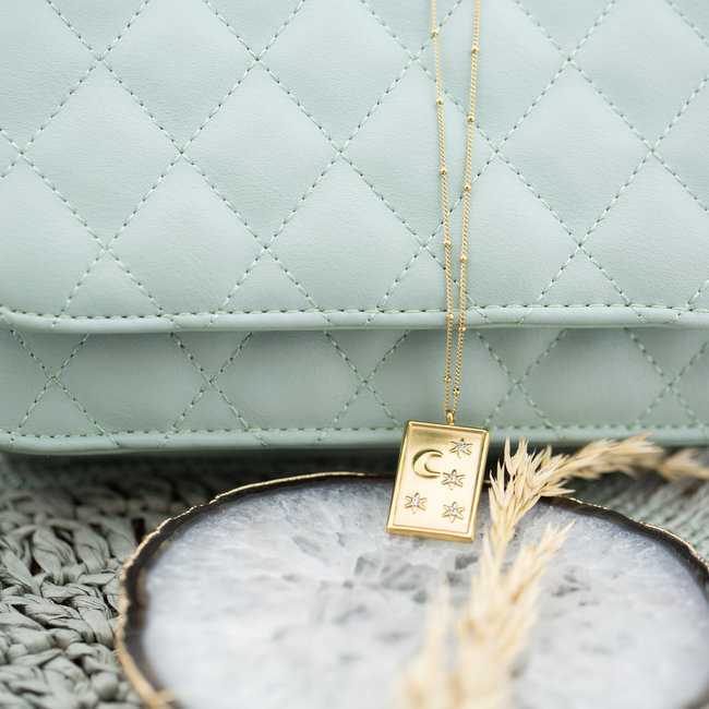 Day & Eve  Bolletjesketting goud met maan en sterren