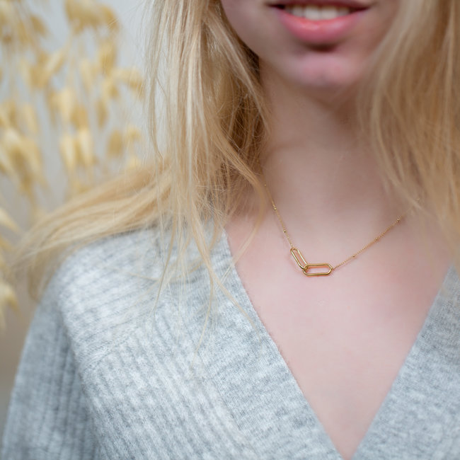 Goudkleurige schakelketting met rechthoekige cirkels