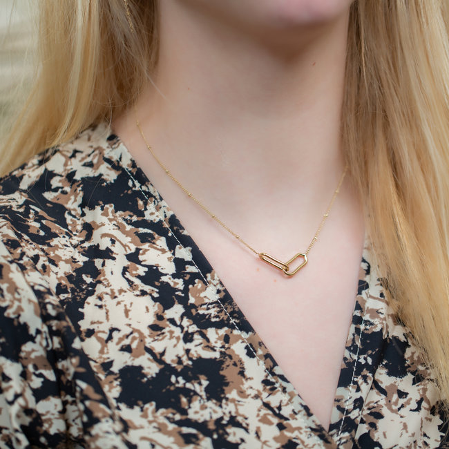 Goudkleurige schakelketting met rechthoekige cirkels
