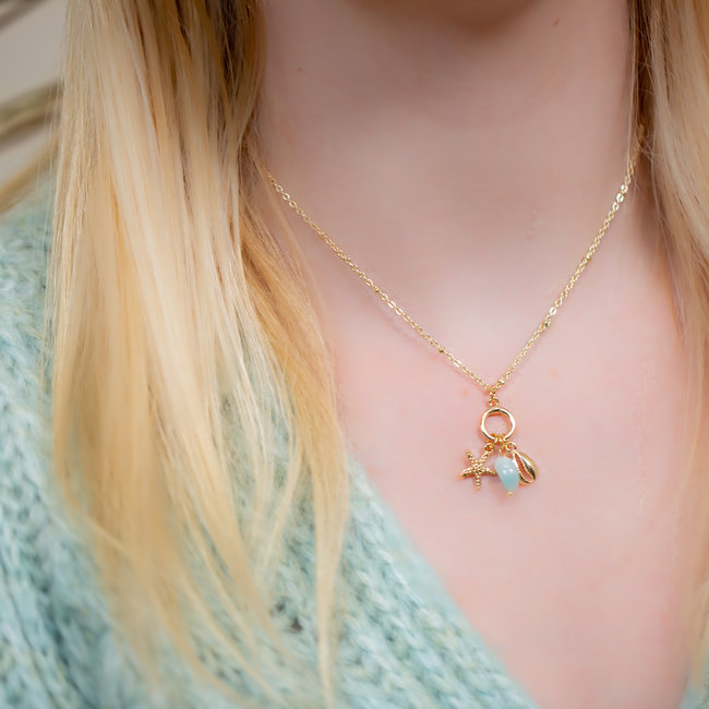 Biba Goud schakelketting met ronde ring  turquoise bedels