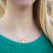 Biba Goud schakelketting met strand bedels