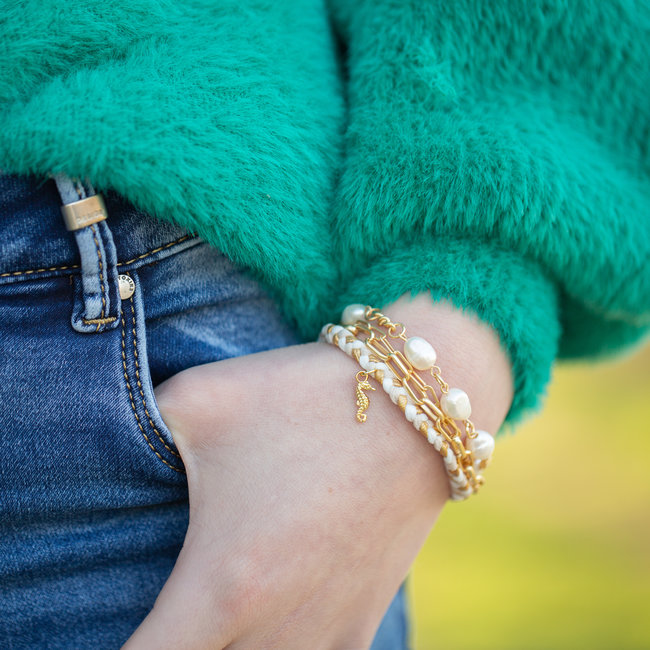 Schakelarmband goud met parels of gevlochten
