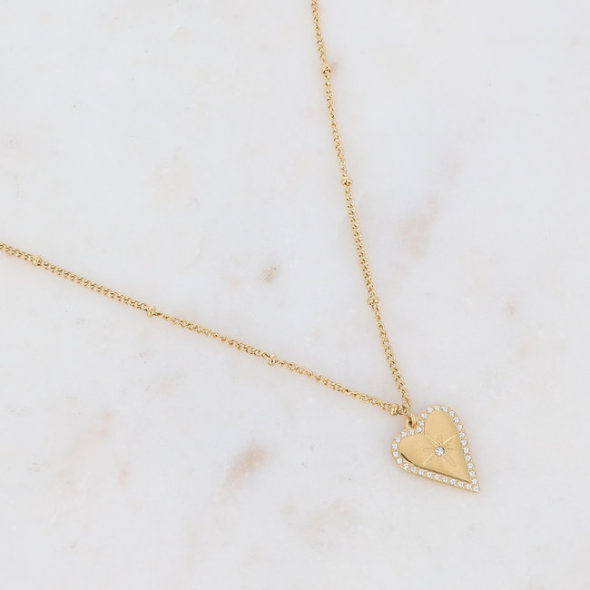 Goud schakelketting met ringen of hart
