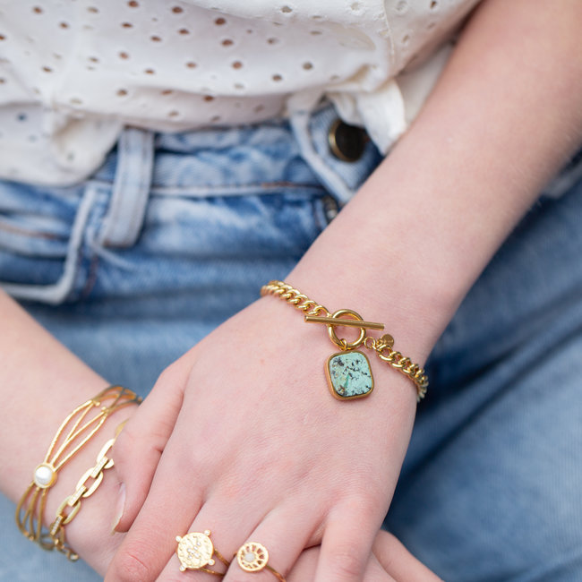 Schakelarmband met turquoise steen hanger