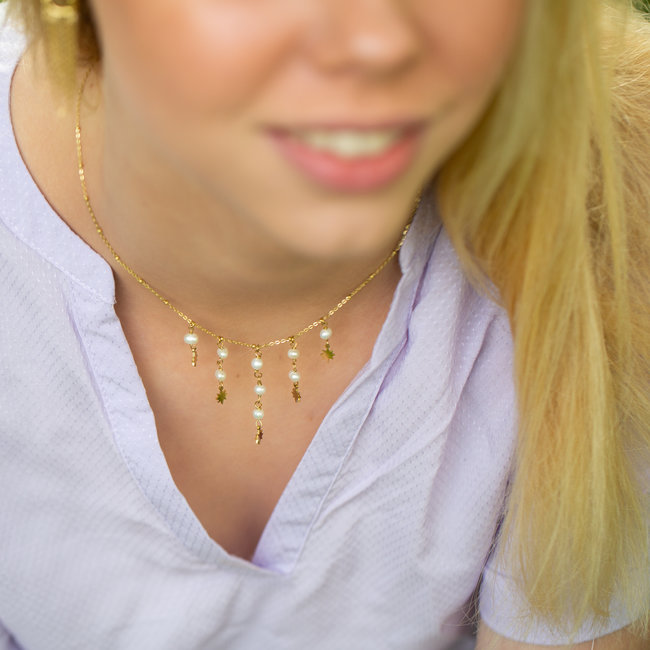 Goud ketting met witte parels en sterren