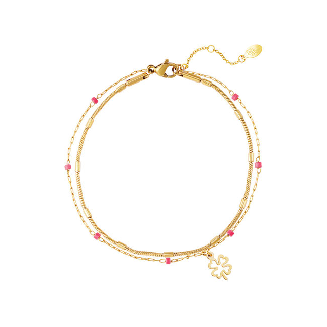 Dubbele goud met roze klaver armband