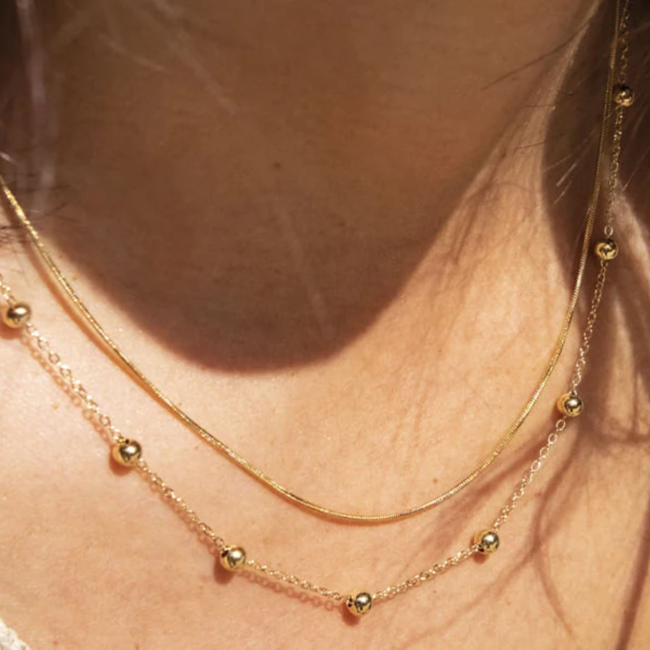 Dubbele ketting met bolletjes goudkleurig
