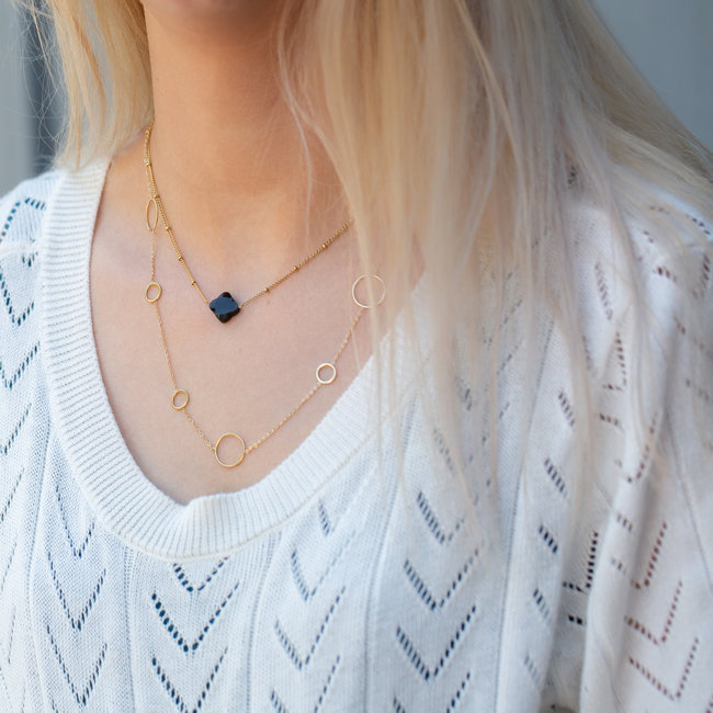 Day & Eve  Zwarte klaver of cirkelketting goud