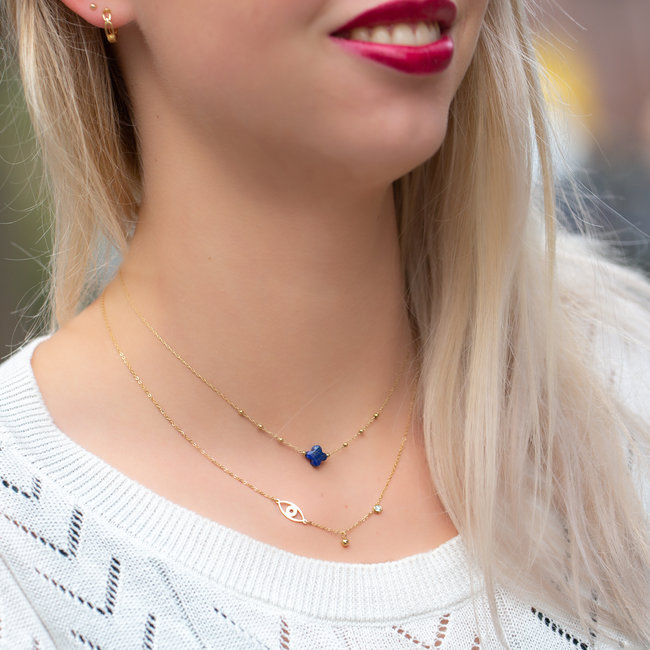 Ketting met kobalt blauwe klaver of oogje goudkleurig