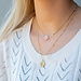 Day & Eve by Go Dutch Label Goud ketting met roze klaver of munt met maan