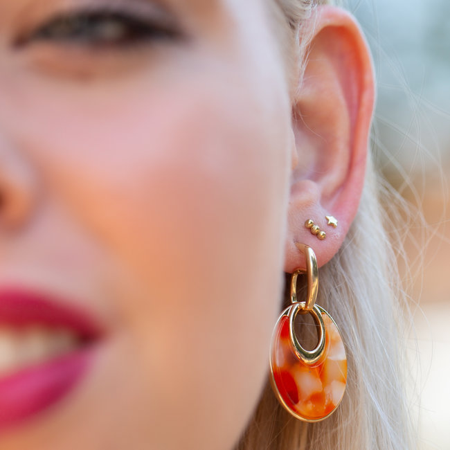 Warm oranje schijf oorbellen goud