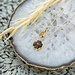 ZAG  Bijoux Goud ketting met tijgeroog  of bloem