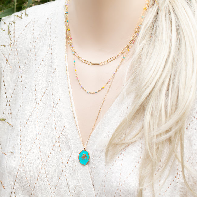 Goud driedubbele ketting met turquoise steen