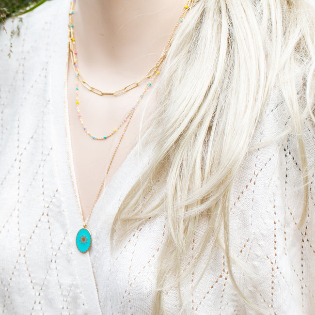 Goud driedubbele ketting met turquoise steen