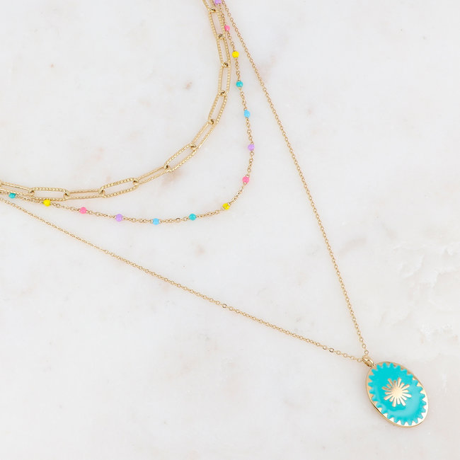 Goud driedubbele ketting met turquoise steen