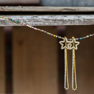 Day & Eve  Goud oorhangers met sterren en kristal