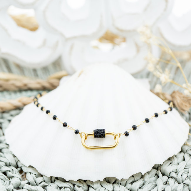 Goud ketting met ovaal hanger en zwarte strass
