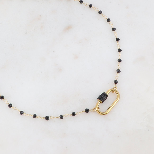 Goud ketting met ovaal hanger en zwarte strass
