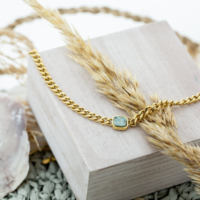 Goud schakelketting met steen