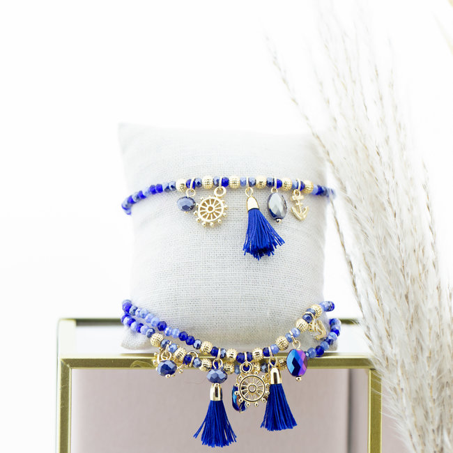 Blauwe kralen armband met kwastje