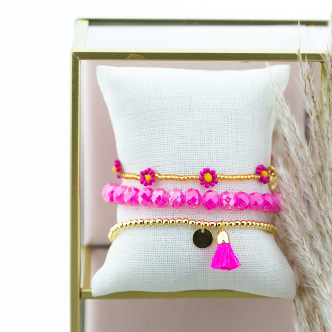 Felroze armband bloemen en kwast
