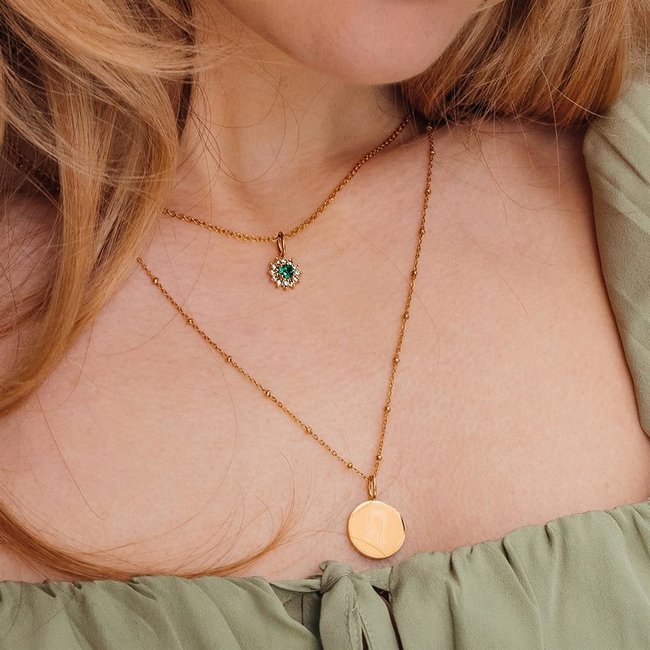 Goud Ketting met groene bloem of sterrenbeeld