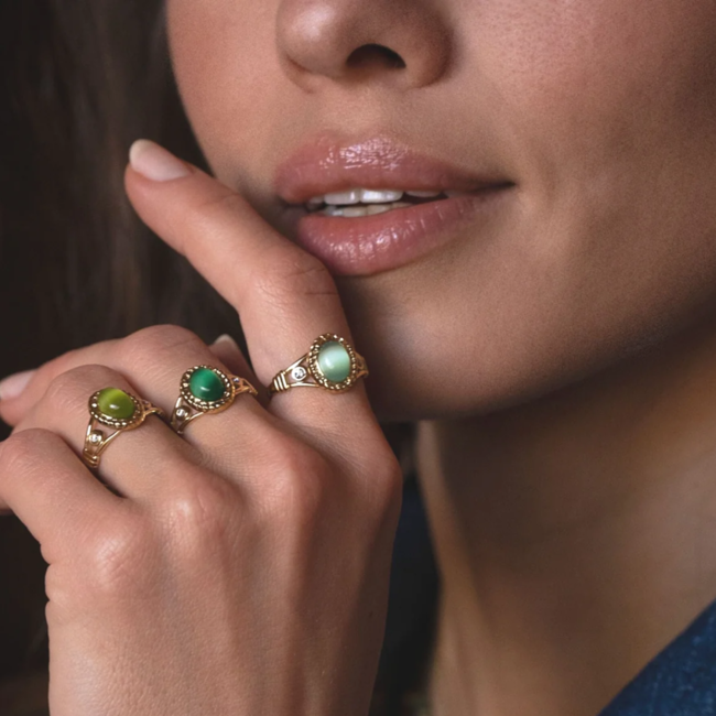 Stainless steel gouden ring met ovaal groene steen