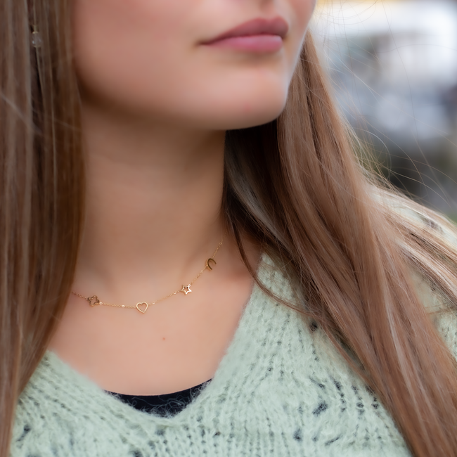 Goud ketting met symbolen klaver, ster, hartje