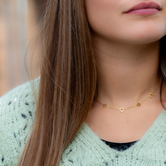 Goud ketting met symbolen klaver, ster, hartje