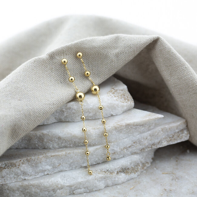 Day & Eve  Lange goud bolletjes stainless steel oorbellen