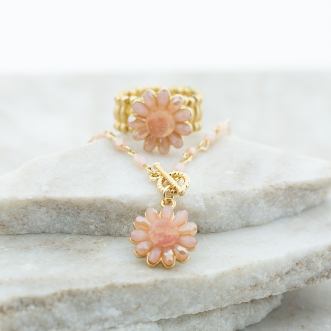 Straal met dit setje van ketting en ring met bloem