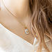 Beadle Goud ketting met ovaal witte hanger Beadle Goud ketting met ovaal witte hanger