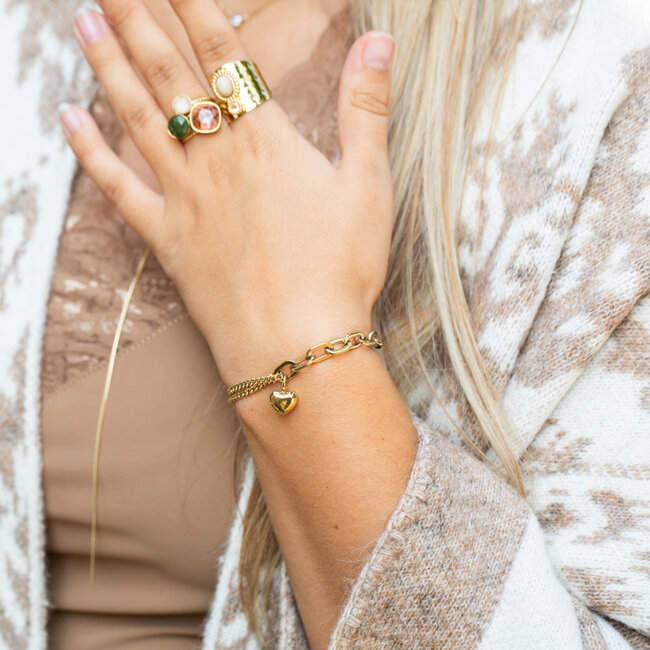 Gouden grovere schakelarmband met hart