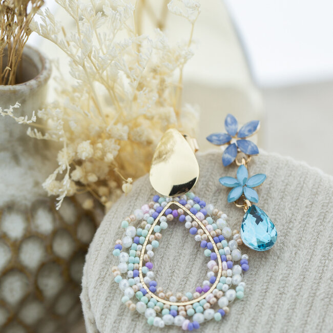 Blauwe druppel of bloemen oorbellen