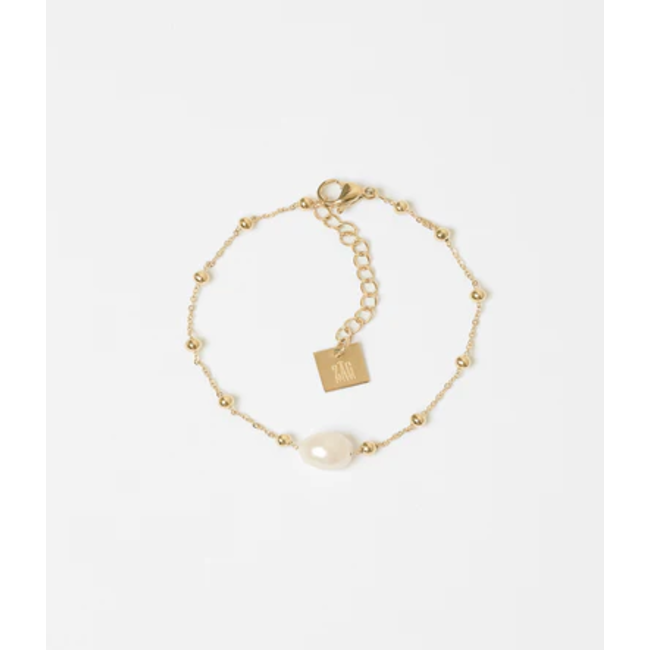 Goud bolletjes armband met witte parel
