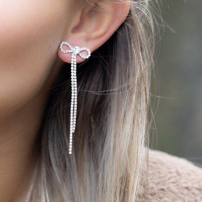 Biba Zilver party strik oorbellen met glitter steentjes