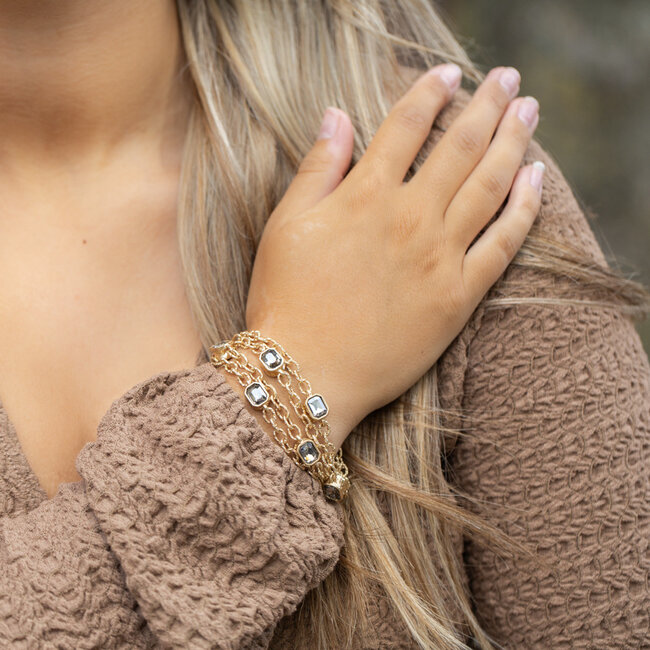 Brede armband met schakels en grijze crystal stenen