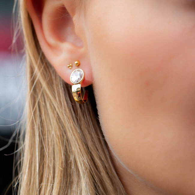 Goud shiny oorbellen met ovaal steen