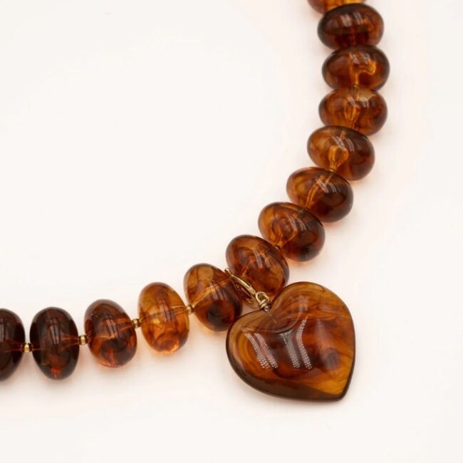Goud ketting met grote rondel kralen en groot hart hanger