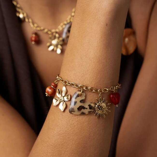 Gouden schakelarmband met tijgerhart, bloem en zon bedels