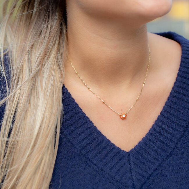 Goud ketting met bruin oranje bloemetje