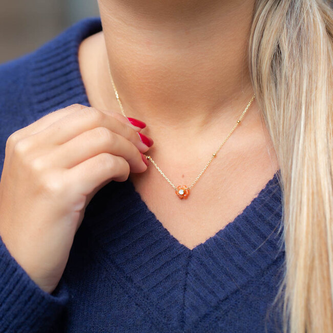 Goud ketting met bruin oranje bloemetje