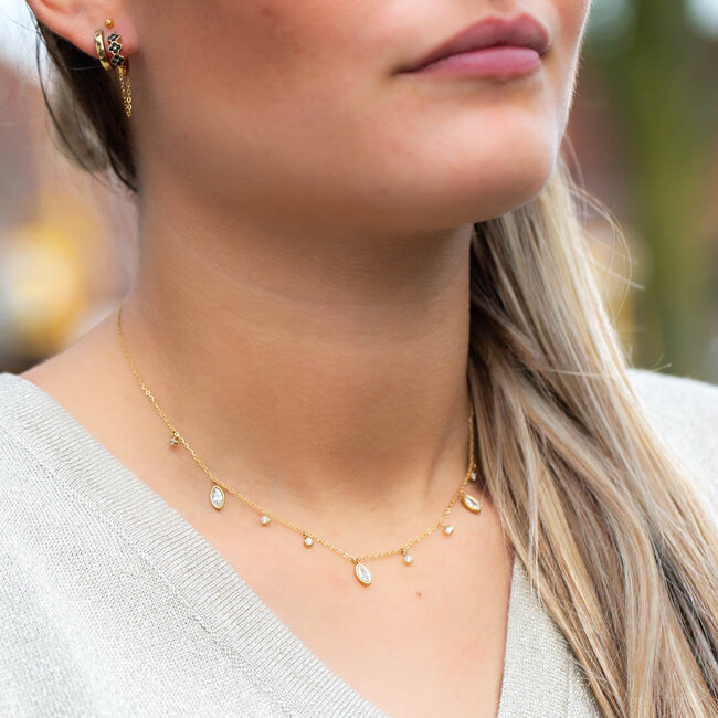 Goud ketting met glinsterende ovaal shiny bedels
