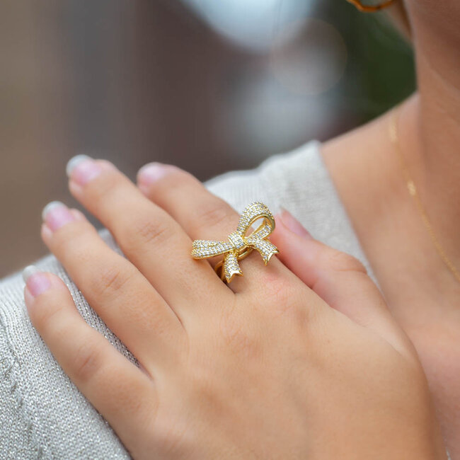 Gouden strik ring met glitters