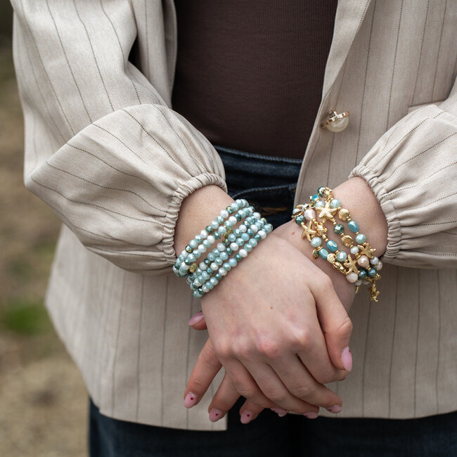 Strand armband met schelp bedel