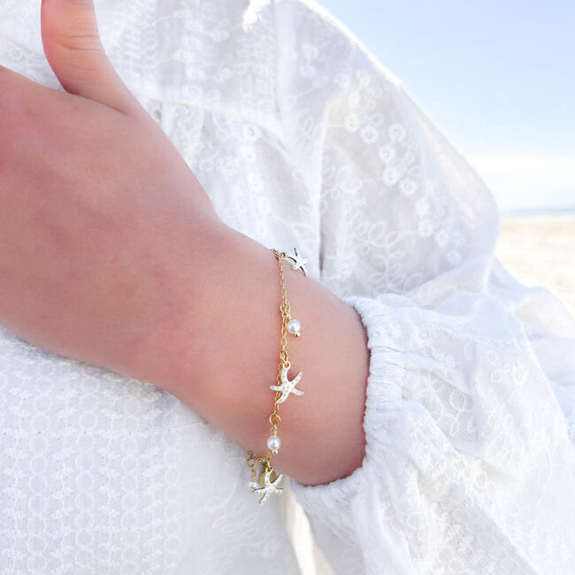 Witte zeester en parel armband