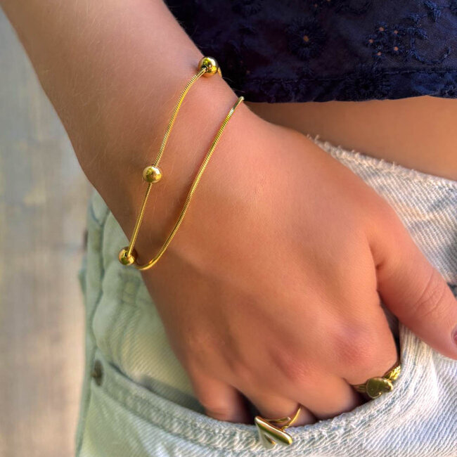 ZAG  Bijoux Tijdloze dubbele armband met goudkleurige bolletjes