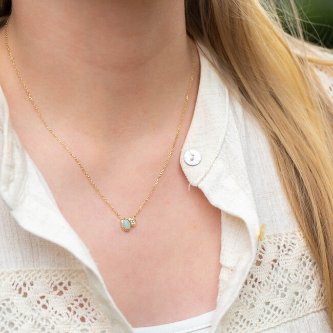 Goud ketting met crystal en mint steentje