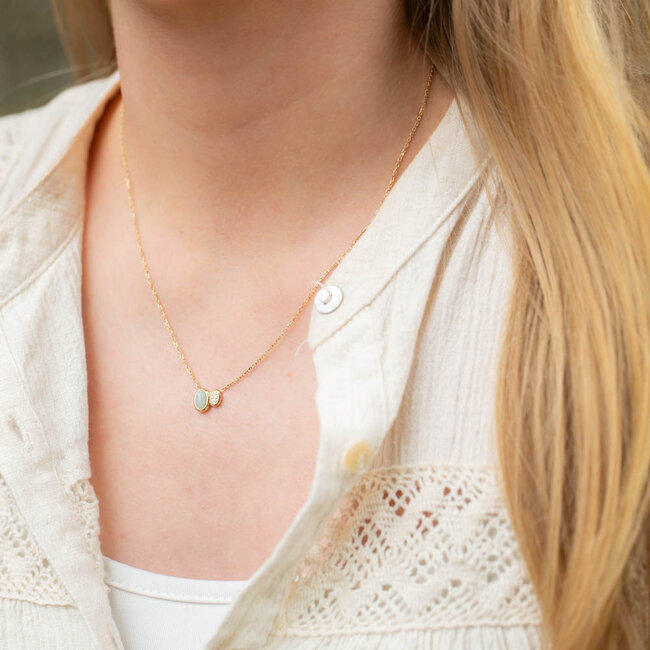 Goud ketting met crystal en mint steentje